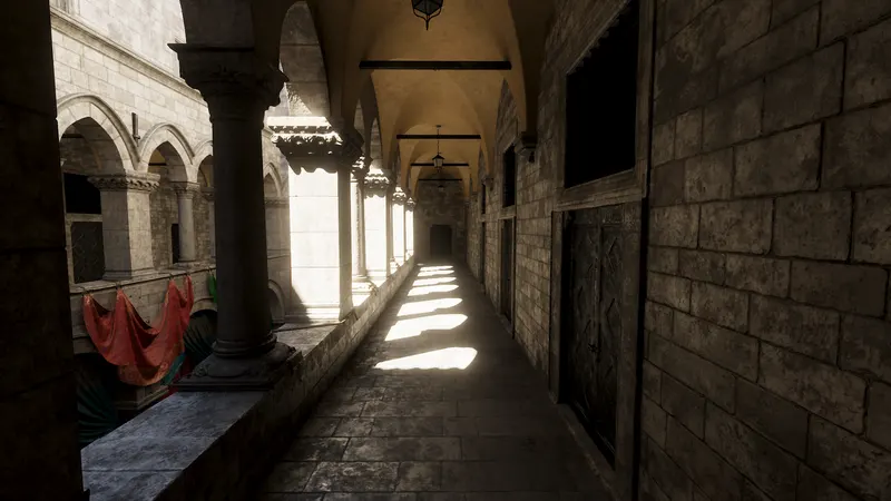 A vaulted stone corridor with hard shafts of sunlight falling across the floor and the ceiling lit only by light bouncing up off the stone.